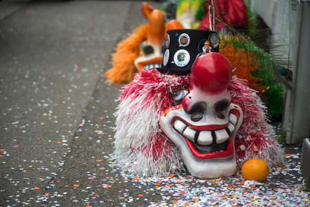 Mulhouse - France - 17 february 2024 - Closeup of traditional carnival masks posing on the floor  before the carnivalのeditorial素材