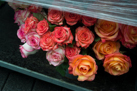 Closeup of orange roses bouquets at the florist in the streetの写真素材