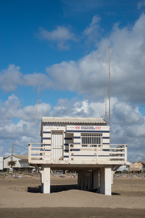 Gruissan - France - 27 April 2024 - view of wooden life guard station on the beach on beautiful cloudy sky backgroundのeditorial素材