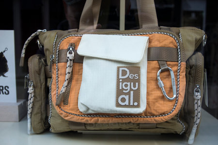 Strasbourg - France - 25 May 2024 - Closeup of  desigual hand bag  in a luxury fashion store showroomのeditorial素材