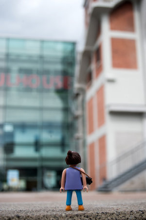 Mulhouse - France - 31 May 2024 - portrait on back view of photographer playmobil standing in the streetのeditorial素材