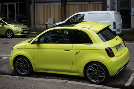 Mulhouse - France - 31 May 2024 - profile view of yellow fiat abarth 595 parked in the streetのeditorial素材