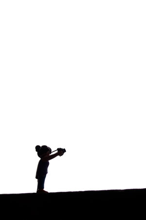Mulhouse - France - 31 May 2024 - silhouette of photographer playmobil standing in the street on...