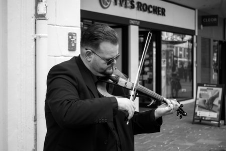 Mulhouse - France - 4 June 2024 - Portrait of musician playing violin in the streetのeditorial素材