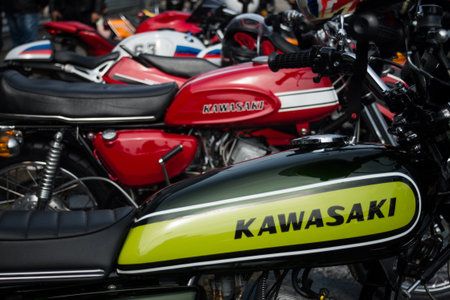Mulhouse - France - 9 June 2024 - closeup of green tank of vintage kawasaki motorbike parked in the streetのeditorial素材