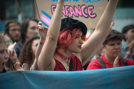 Strasbourg - France - 15 June 2024 - portrait of people parading in the street with rainbow flagsのeditorial素材