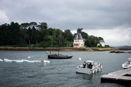 Douarnenez - France - 12 July 2024 - view of sailboat in the sea on cloudy sky backgroundのeditorial素材