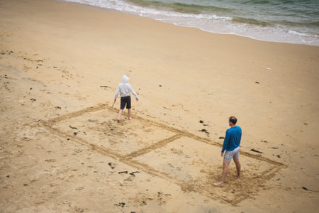 Douarnenez - France - 12 July 2024 - portrait of people playing on the beachのeditorial素材