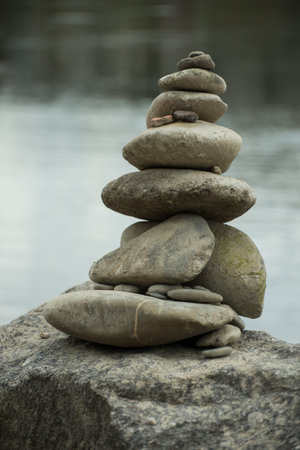 Closeup of stone balance in border riverの写真素材