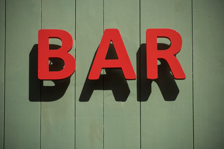 Closeup of bar signage on the wall in the streetの写真素材