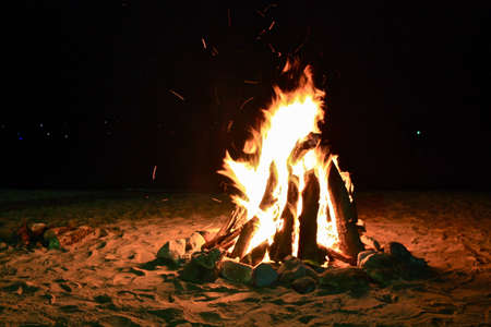 Bonfire on a beach at nightのeditorial素材