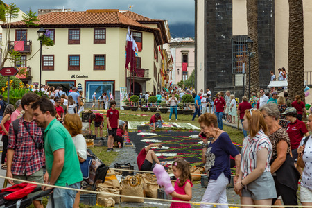 la Orotava, Tenerife, Spain - June 27, 2019. Beautiful flower carpets in La Orotava during Corpus Christi. Famous religious event and competition of folk art.. Warm summer evening and joyful visitors.のeditorial素材