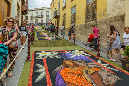 la Orotava, Tenerife, Spain - June 27, 2019. Beautiful flower carpets in La Orotava during Corpus Christi. Famous religious event and competition of folk art.. Warm summer evening and joyful visitors.のeditorial素材