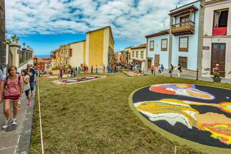 la Orotava, Tenerife, Spain - June 27, 2019. Beautiful flower carpets in La Orotava during Corpus Christi. Famous religious event and competition of folk art.. Warm summer evening and joyful visitors.のeditorial素材