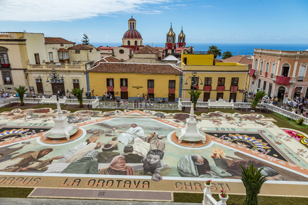 la Orotava, Tenerife, Spain - June 27, 2019. Beautiful flower carpets in La Orotava during Corpus Christi. Famous religious event and competition of folk art.. Warm summer evening and joyful visitors.のeditorial素材