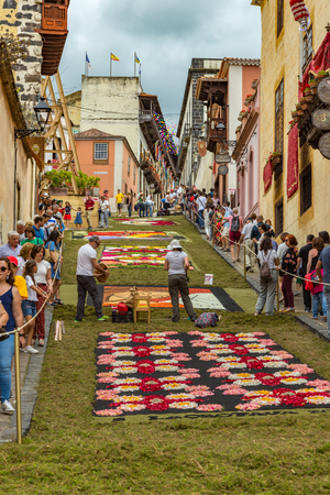 la Orotava, Tenerife, Spain - June 27, 2019. Beautiful flower carpets in La Orotava during Corpus Christi. Famous religious event and competition of folk art.. Warm summer evening and joyful visitors.のeditorial素材