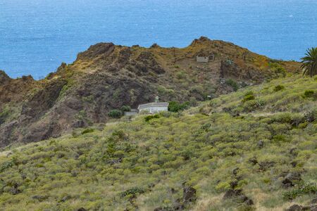 Parque Natural Majona. Northeastern part of La Gomera Island. Old volcanic mountains covered by green grass, thickets of relic laurels and heather on steep slopes. Canary Islands, Spain.の写真素材