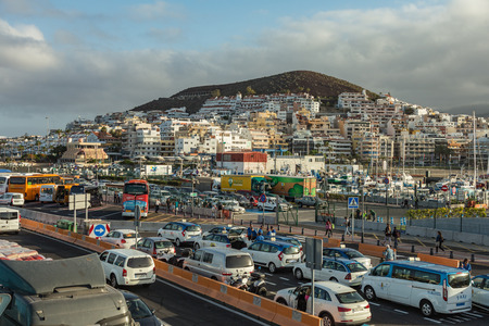 Harbor in Los Cristianos, Tenerife, Spain - May 25, 2019 - Ferry Armas to La Gomera early morning in the port of Los Cristianos docking to the harbour.のeditorial素材