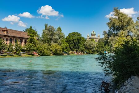 Bern, Switzerland - July 30, 2019: View of Aare river at sunny summer day. Local residents relax,...