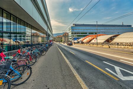 Bern, Switzerland - July 26, 2019: many bicycles parked in the street near the main train station and Post office in the capital of Switzerland..のeditorial素材
