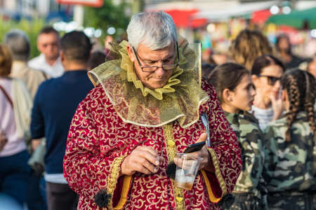 SANTA CRUZ DE TENERIFE, SPAIN - FEBRUARY 25, 2020: Around the Coso parade - along the Avenida de Anaga, official end of Carnival. Amazing warm evening, joyful people in carnival costumes have fun.のeditorial素材
