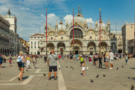 St. Mark Square, VENICE, ITALY - August 02, 2019: Loggetta del Sansovino museum, Torre dell...