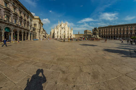 MILAN, ITALY - AUGUST 1, 2019 : The piazza, looking roughly north-east to the Duomo - on the right, and the arch that marks the entrance to Galleria Vittorio Emanuele II - on the left.のeditorial素材