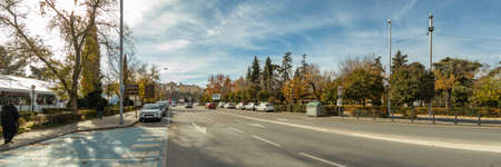 Toledo, Spain - Dec 17, 2018: The Cardenal Tavera Street in the direction to the Puerta Nueva de Bisagra. On the right - Park La Vega in Toledo city, Spain, Europe. Wide angle panorama.のeditorial素材