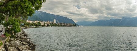 Wde angle Panorama. View on swiss promenade, alpine riviera and Lake Geneva landscape in Montreux city in SWITZERLAND.の写真素材