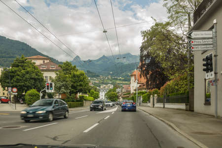 Montreux,SWITZERLAND-Switzerland - June 26, 2016: Shot from car. Montreux is a municipality and a Swiss town on the shoreline of Lake Geneva at the foot of the Alps.のeditorial素材