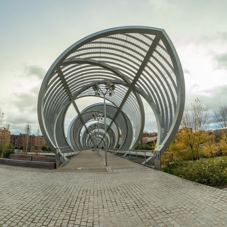 MADRID, SPAIN - DECEMBER 13, 2018: The Arganzuela bridge over Manzanares River downtown Madrid, Spain. It is a futuristic structure built in 2011.のeditorial素材