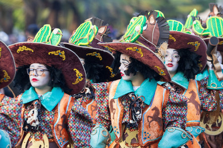 SANTA CRUZ DE TENERIFE, SPAIN - FEBRUARY 13, 2024: The Coso parade, Cavalcada - along the Avenida de Anaga, official end of Carnival. Amazing warm evening, joyful people in carnival costumes have fun.のeditorial素材