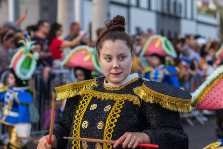 SANTA CRUZ DE TENERIFE, SPAIN - FEBRUARY 13, 2024: The Coso parade, Cavalcada - along the Avenida de Anaga, official end of Carnival. Amazing warm evening, joyful people in carnival costumes have fun.のeditorial素材