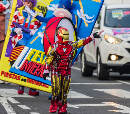 SANTA CRUZ DE TENERIFE, SPAIN - FEBRUARY 13, 2024: The Coso parade, Cavalcada - along the Avenida de Anaga, official end of Carnival. Amazing warm evening, joyful people in carnival costumes have fun.のeditorial素材