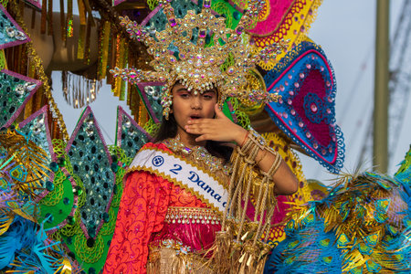 SANTA CRUZ DE TENERIFE, SPAIN - FEBRUARY 13, 2024: The Coso parade, Cavalcada - along the Avenida de Anaga, official end of Carnival. Amazing warm evening, joyful people in carnival costumes have fun.のeditorial素材