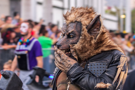 SANTA CRUZ DE TENERIFE, SPAIN - FEBRUARY 13, 2024: The Coso parade, Cavalcada - along the Avenida de Anaga, official end of Carnival. Amazing warm evening, joyful people in carnival costumes have fun.のeditorial素材
