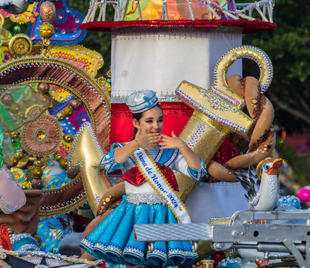 SANTA CRUZ DE TENERIFE, SPAIN - FEBRUARY 13, 2024: The Coso parade, Cavalcada - along the Avenida de Anaga, official end of Carnival. Amazing warm evening, joyful people in carnival costumes have fun.のeditorial素材