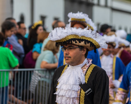 SANTA CRUZ DE TENERIFE, SPAIN - FEBRUARY 13, 2024: The Coso parade, Cavalcada - along the Avenida de Anaga, official end of Carnival. Amazing warm evening, joyful people in carnival costumes have fun.のeditorial素材