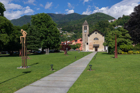Bellinzona Switzerland - May 29, 2022: Catholic church with bell tower and Christian cross. Giubiascoのeditorial素材