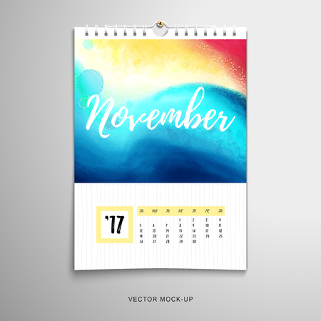 Vector illustration with realistic shadows. Paper spiral calendar with colored spots and blotches. Watercolor hand drawing pattern. Inscription - November.のイラスト素材