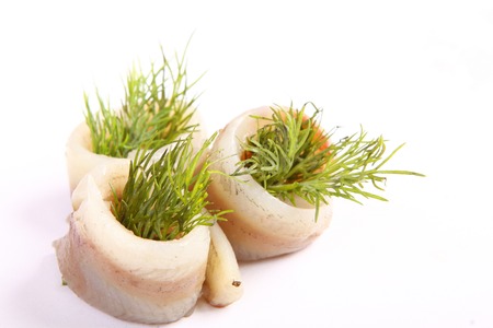 Herring on a red pepper. Herring fillet on sweet peppers. Capelin fillets in an exclusive dish. Fish fillet. Exclusive dish of fish.の写真素材