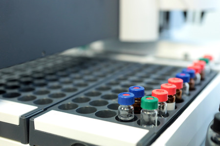 Quality Control Laboratory medicine. Chromatograph operation. Bottles check on the quality of the suspension. Vials on autosampler of gas chromatography-mass spectrophotometer. Ampoules are chemical control suspension in the gas chromatograph. Gas chromatの写真素材