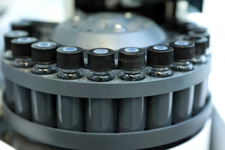 Quality Control Laboratory medicine. Chromatograph operation. Bottles check on the quality of the suspension. Vials on autosampler of gas chromatography-mass spectrophotometer. Ampoules are chemical control suspension in the gas chromatograph. Gas chromatの写真素材
