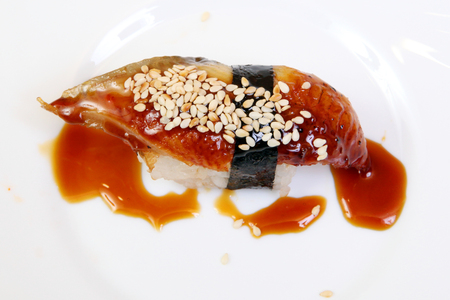 Smoked eel with gravy and cucumber. Sashimi Unagi. Japanese food on a beautiful dish. Dietary food. An exquisite Japanese dish. Dietary.の写真素材