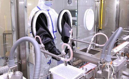 Development of a vaccine against COVID-19. Biochemist scientists examine the virus in the laboratory. Production and research of a vaccine. Unique learning technology.の写真素材