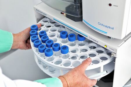 An analyzer with a rotary autosampler at work in a factory. Production of medicine. Studies of a...