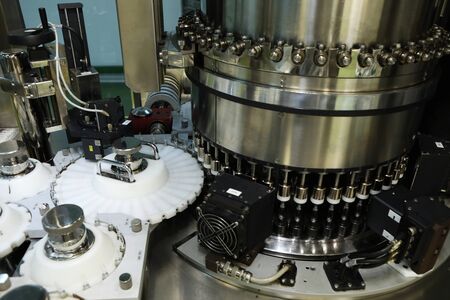 Pharmaceutical industry. Production Line. Fill bottles and ampoules for solid particles in liquid...