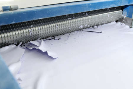 Machine for the production of powder paint. A layer of plastic is cut, crushed and a special paint is producedの写真素材