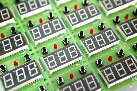 Lots of radios. Loose electronic parts on the table. Digital indicator, LEDs, capacitor and...