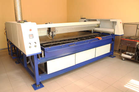 Plasma cutting CNC machine cuts metal material with sparks, industry background aerospace. Robotic...
